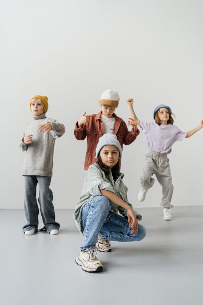 A group of boys posing for a photo in high quality clothing