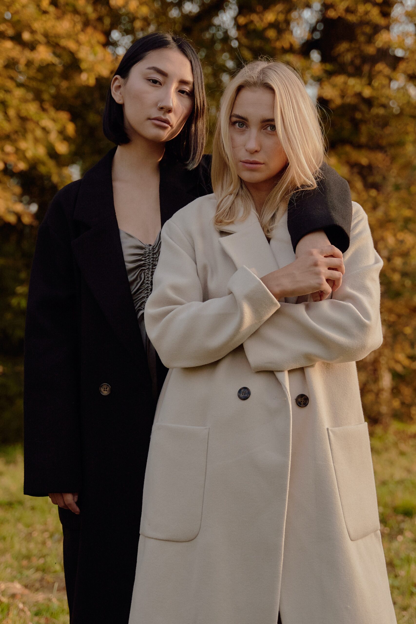 Stay stylish and warm this winter with our range of overcoats! Our latest collection features two gorgeous models, one wearing a classic white overcoat and the other a sleek black one. Perfect for any occasion, these coats are designed to keep you cozy while adding a touch of sophistication to your wardrobe. Browse our selection now and upgrade your winter look