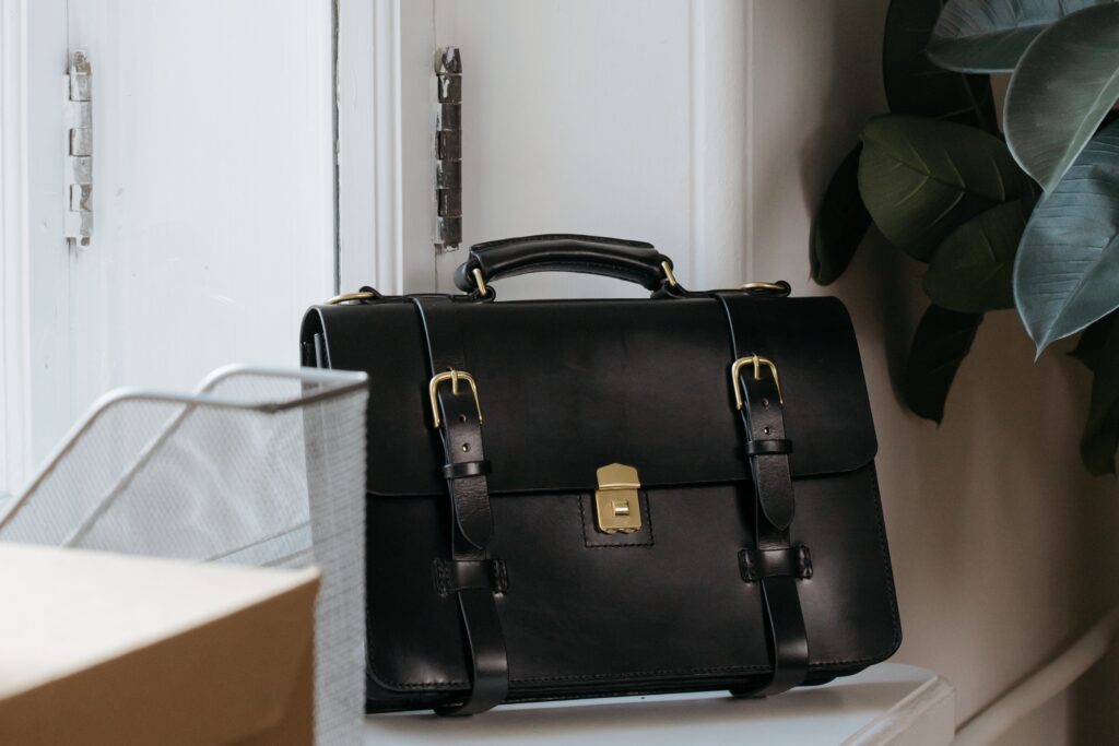 A black men's leather briefcase with straps