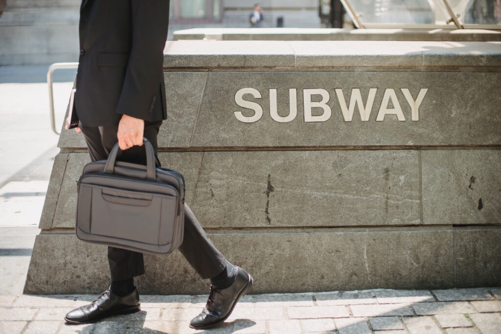 a man in a suit carrying a briefcase.