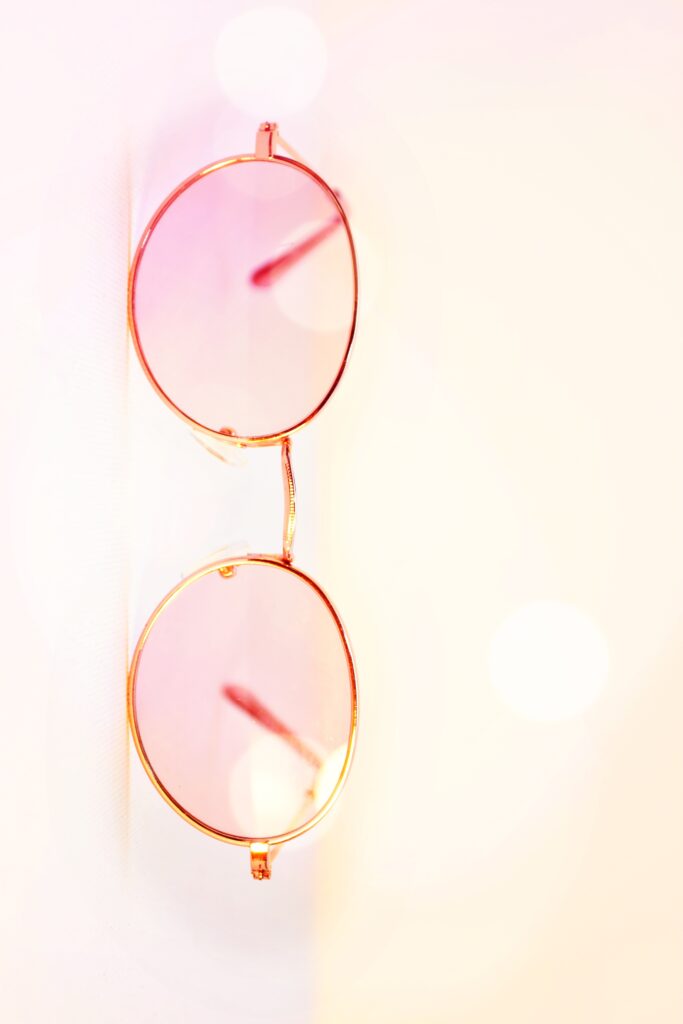 A pair of pink round shaped women's glasses